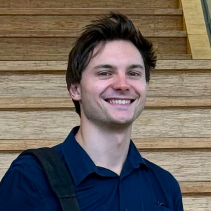 A photo featuring Ko looking into the camera smiling